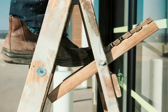 person standing on ladder