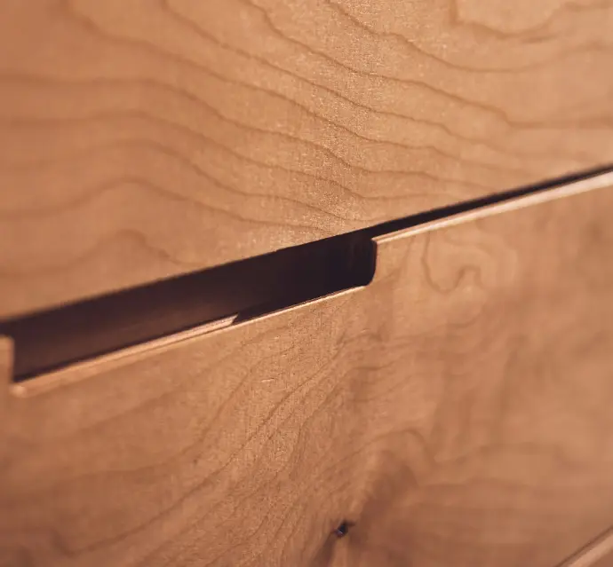 stylish cutout in a drawer face that acts as a handle